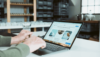A self-employed person creating a Jimdo website on a laptop — simple and smart website creation made easy.